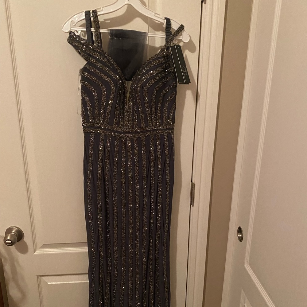 Brand new GLS dress with tags attached in size 4. Charcoal color. GLS by Gloria